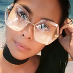Designer Rimless Sunglasses.